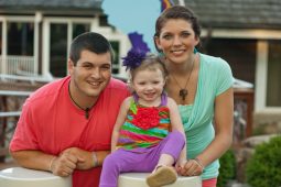 A family of 3 outside The Children's Inn