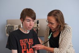 Matthew with his doctor at the NIH Clinical Center