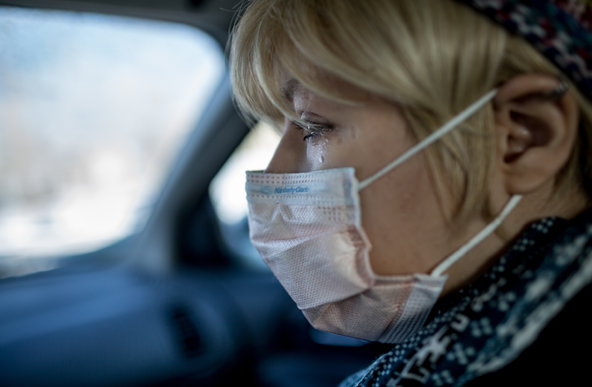 Karly in car with mask and tears