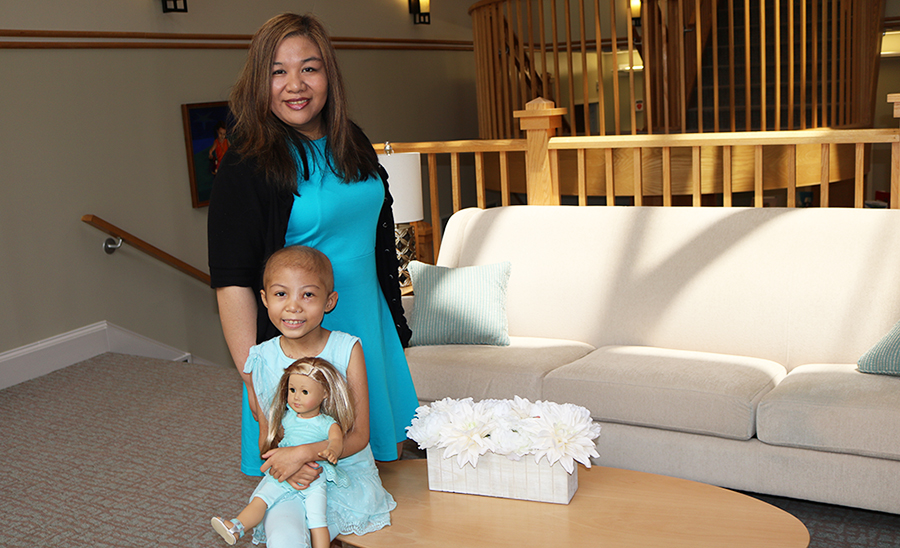 Mother and daughter in teal dresses pose for picture at The Inn