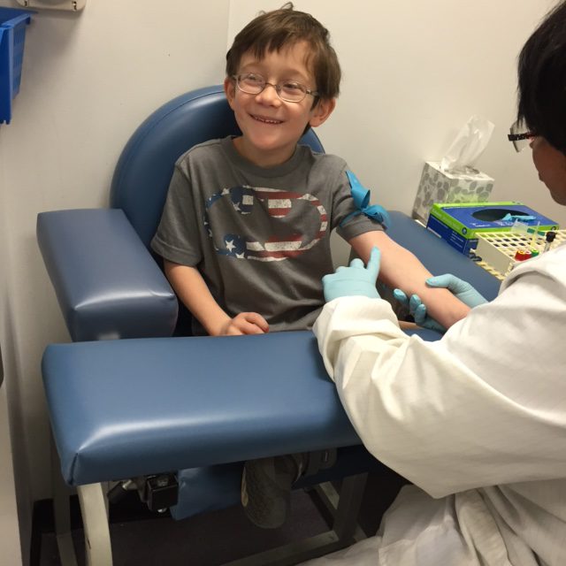 child getting blood drawn