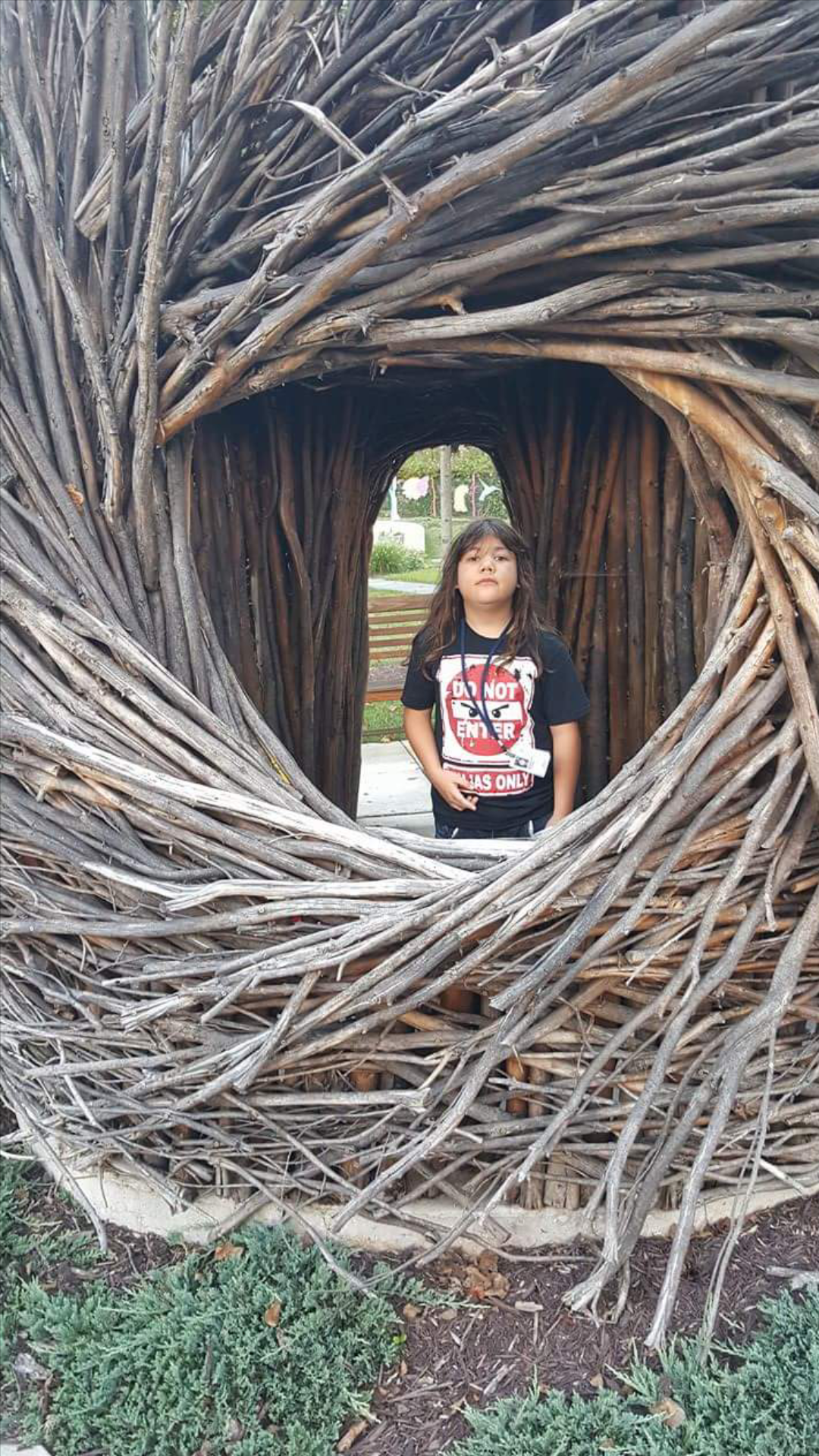 Nicky in a wooden art installation