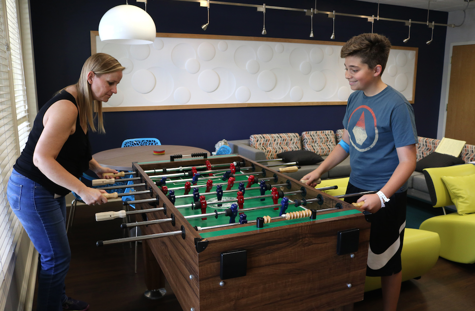 Tom playing foosball at The Inn