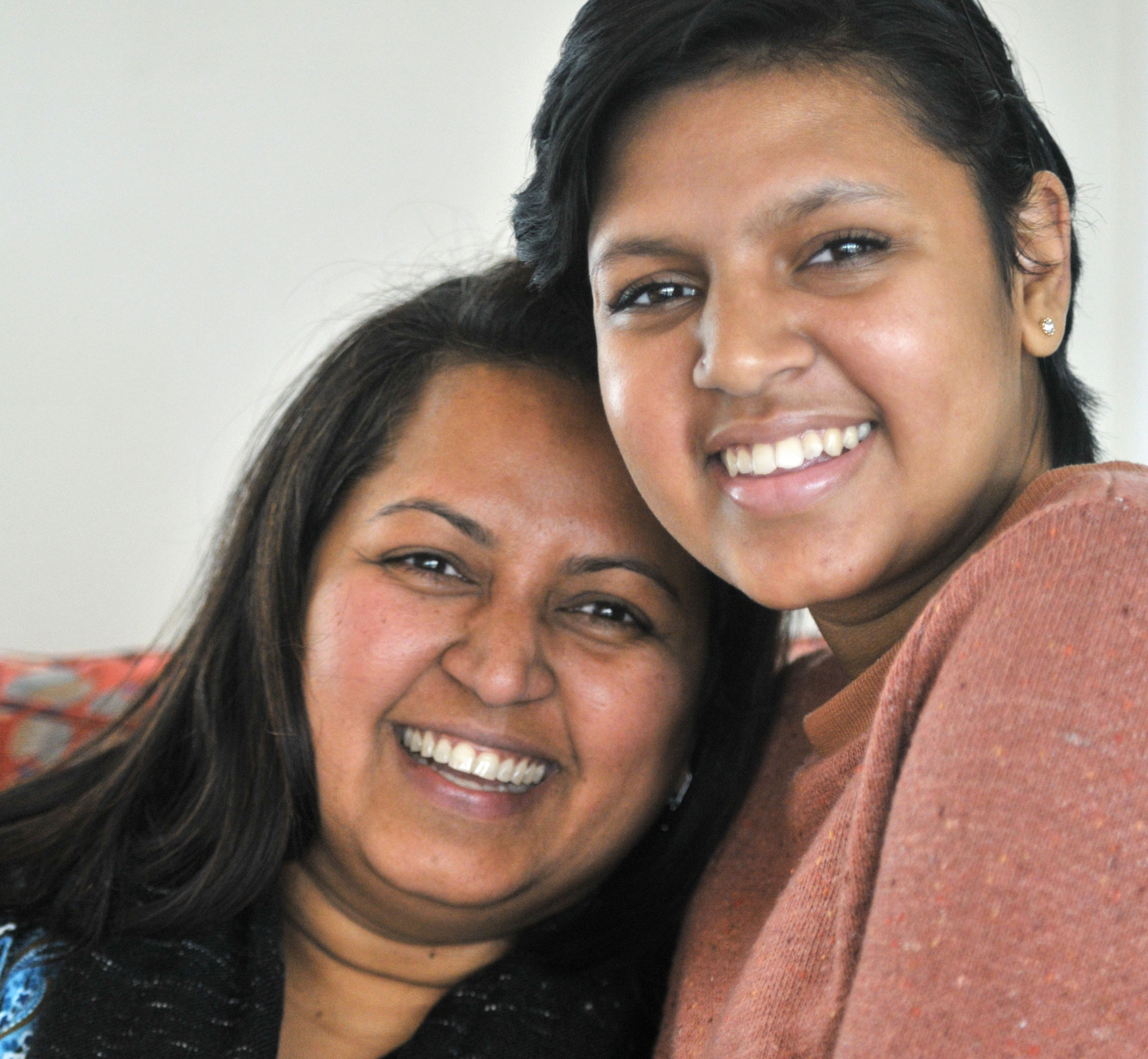 Kavya Nadella holding her mother and posing for a photo