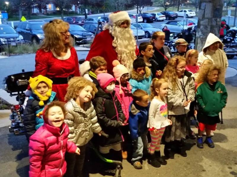 Santa and Mrs. Claus pose with Inn residents