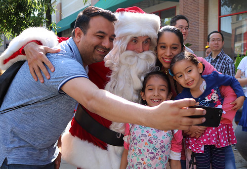 Christmas in July, family posing with Santa