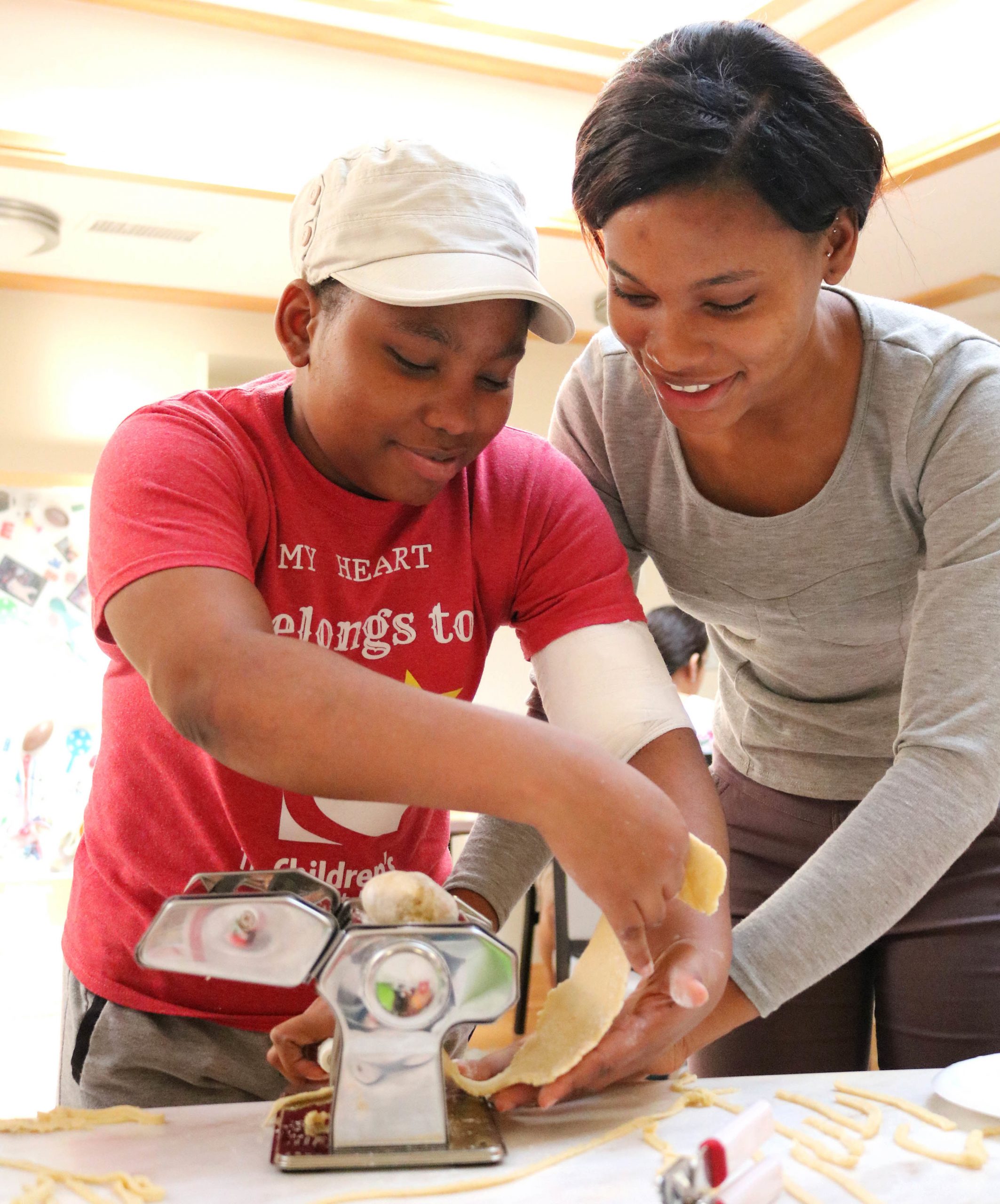 Danielle working at the Teen camp with an Inn Guest