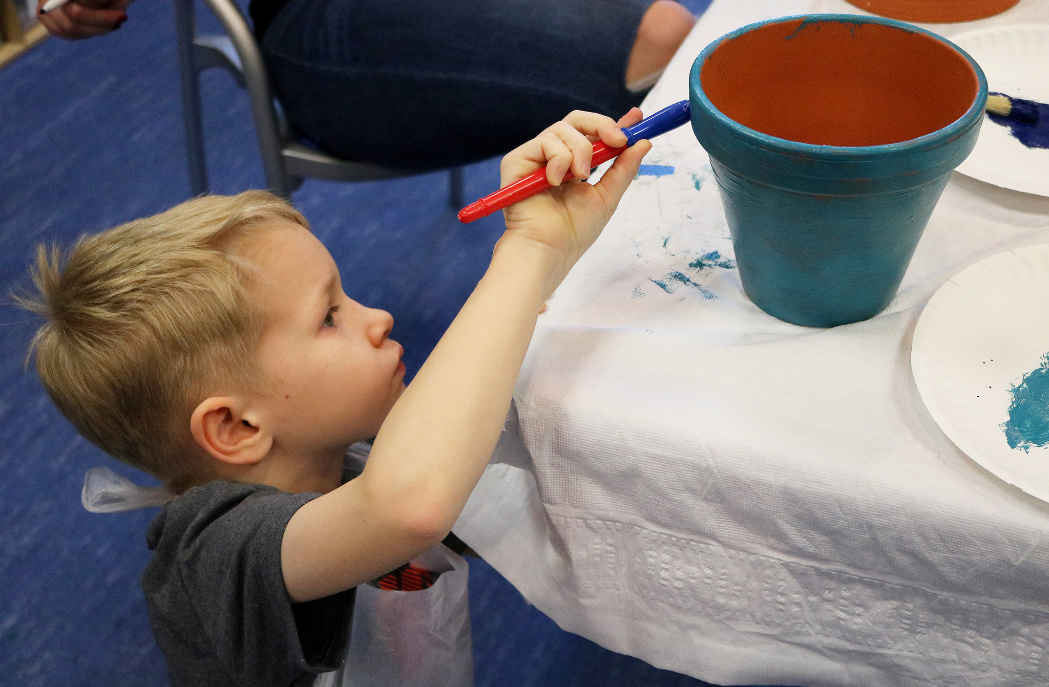 Abram painting a pot