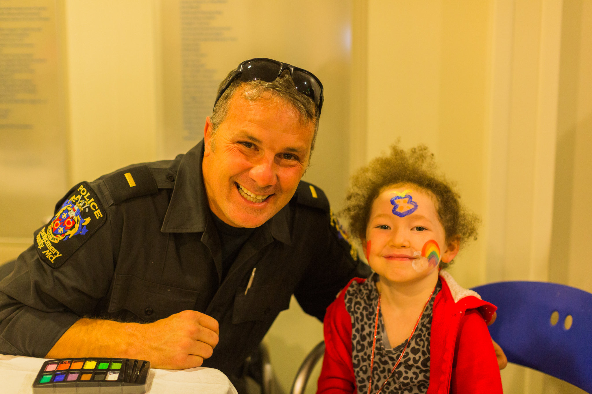 A young girl plays Bingo with Officer Dave