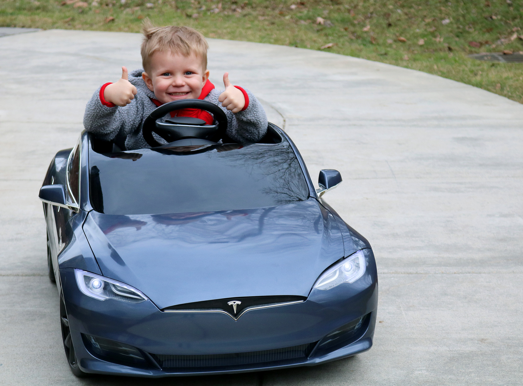 Carson driving the mini electric vehicle