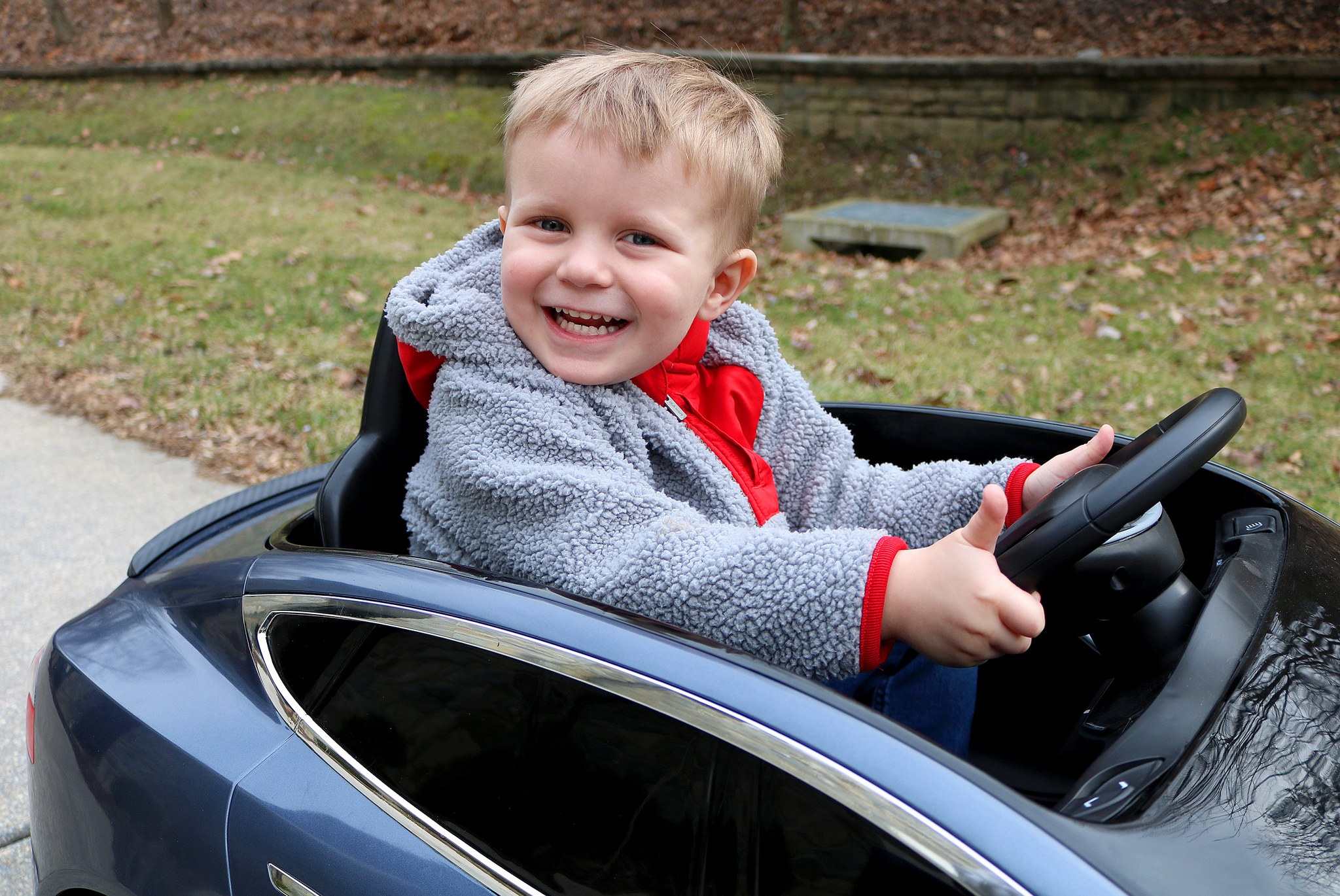 Carson driving around the grey brand new mini Tesla