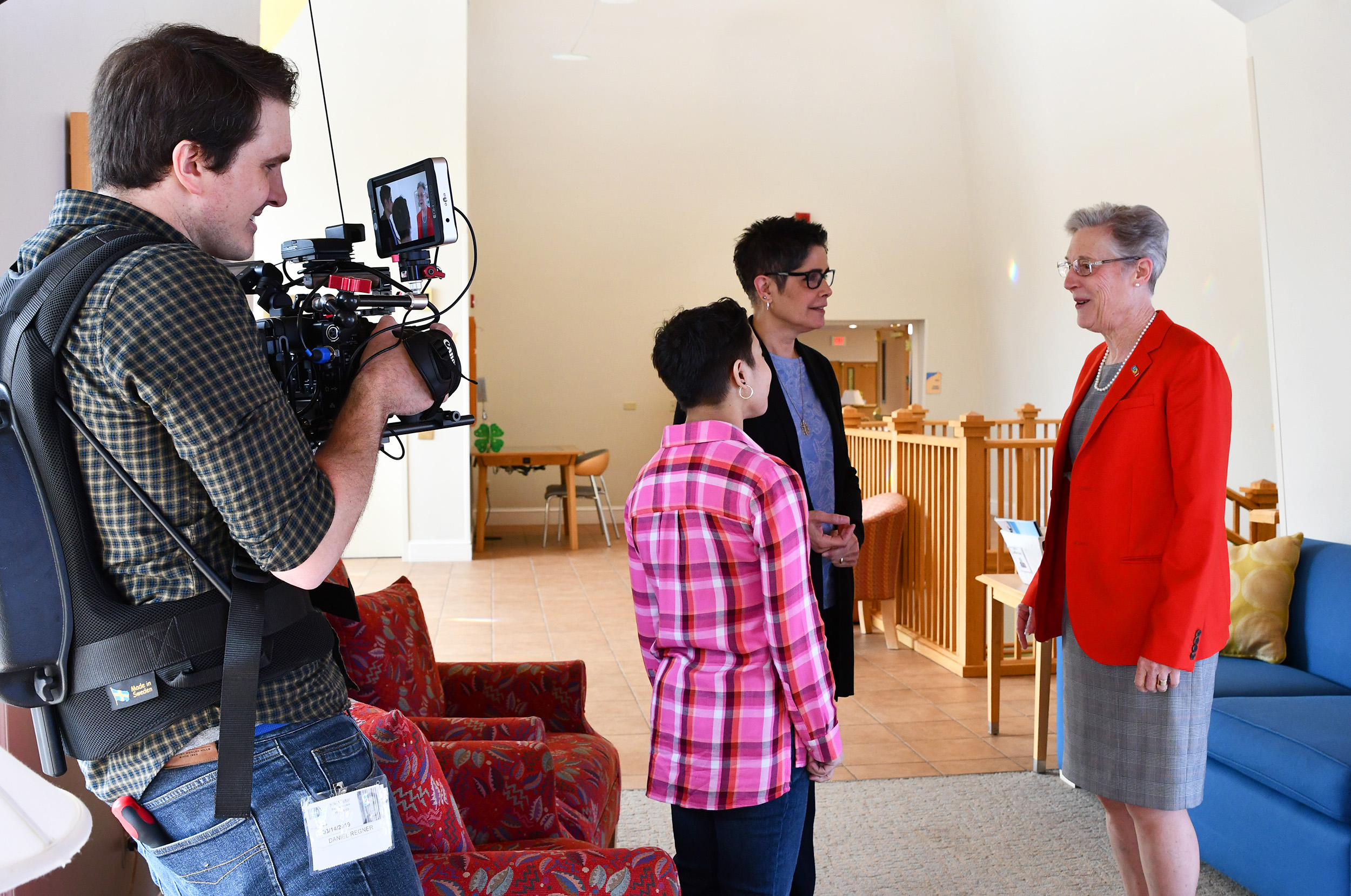 Behind the scenes: Noah, Gisela, and Dr. Tifft are filmed by our crew