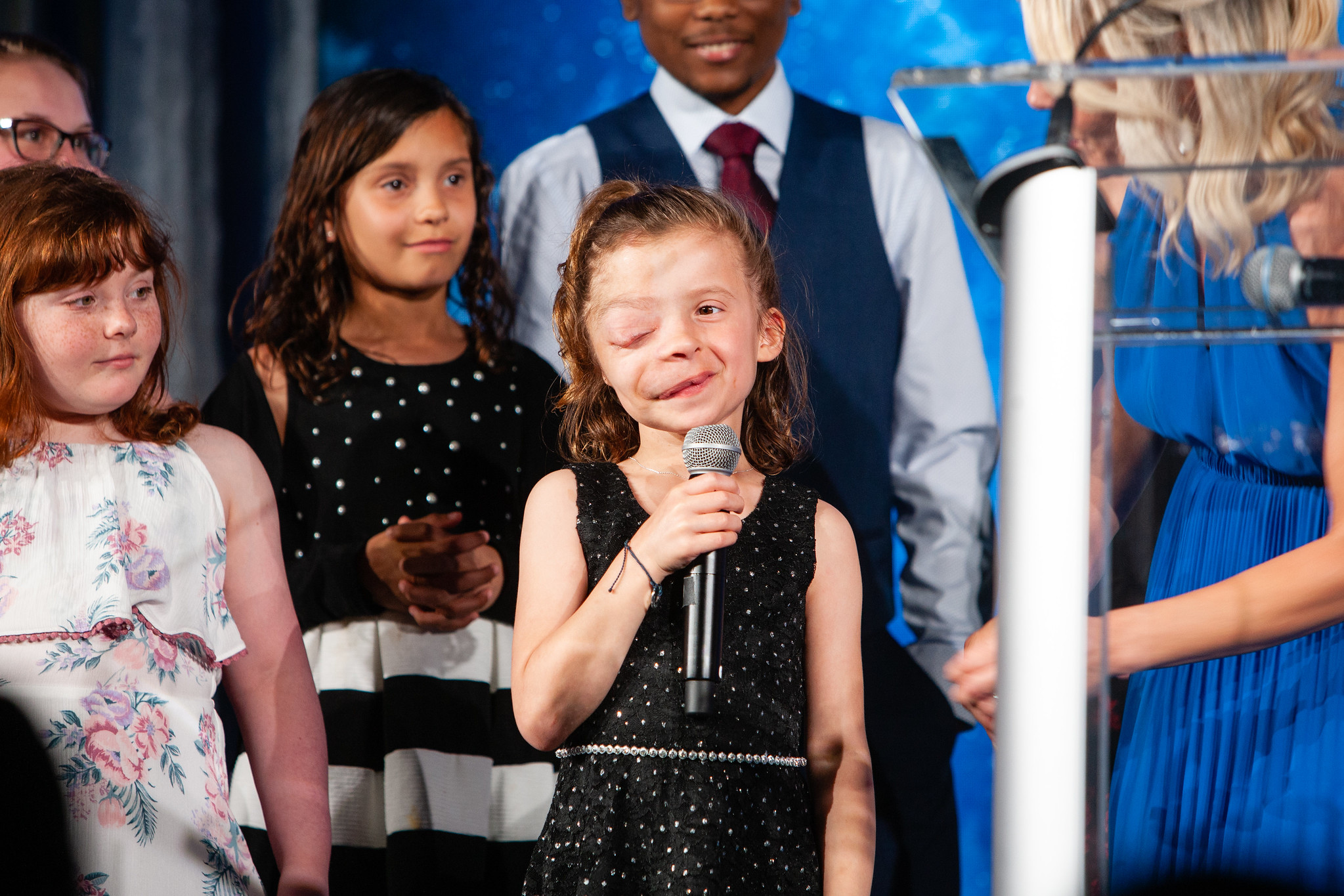 Young girl speaking to an audience