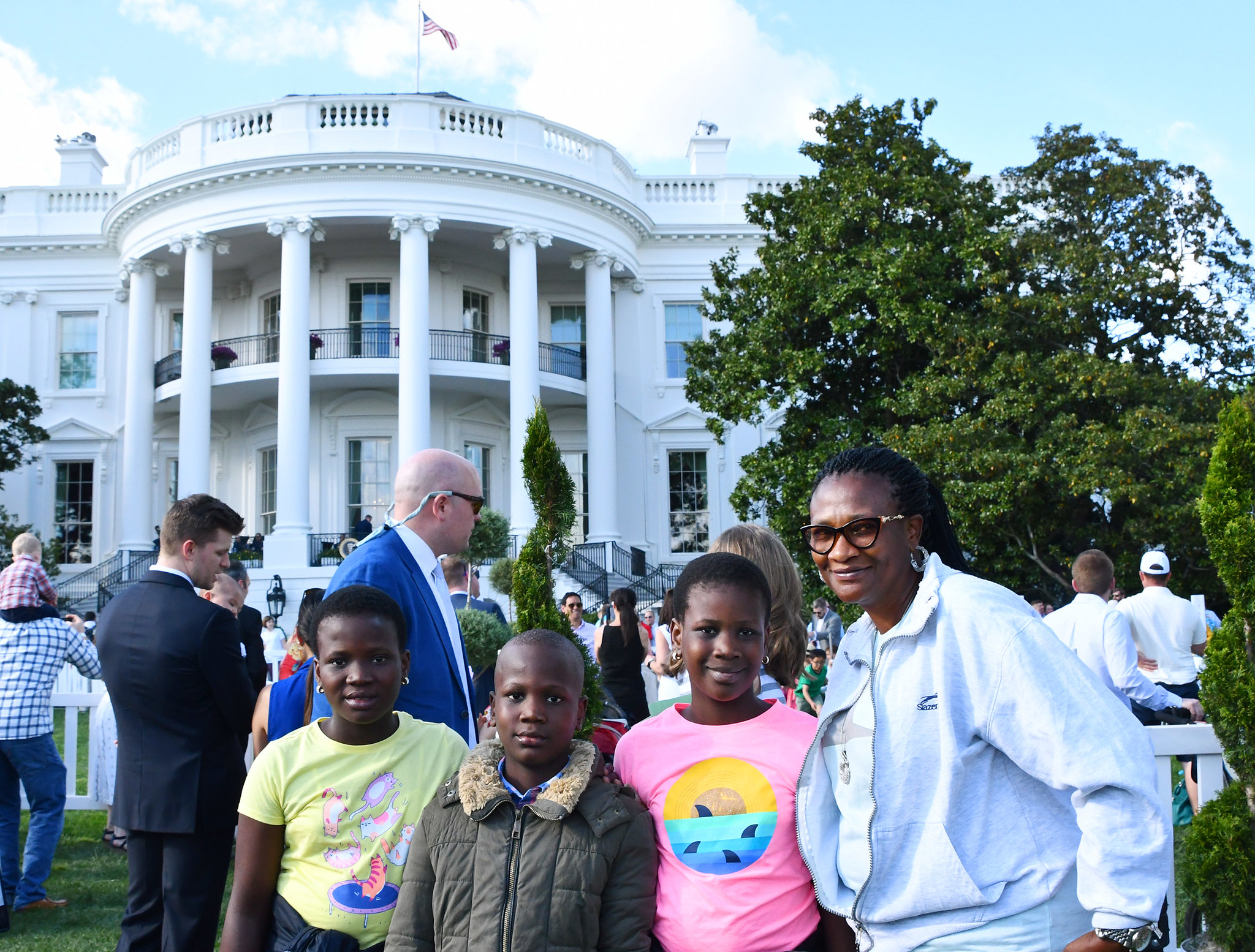 A family in front of the white house Easter Egg Roll 2019