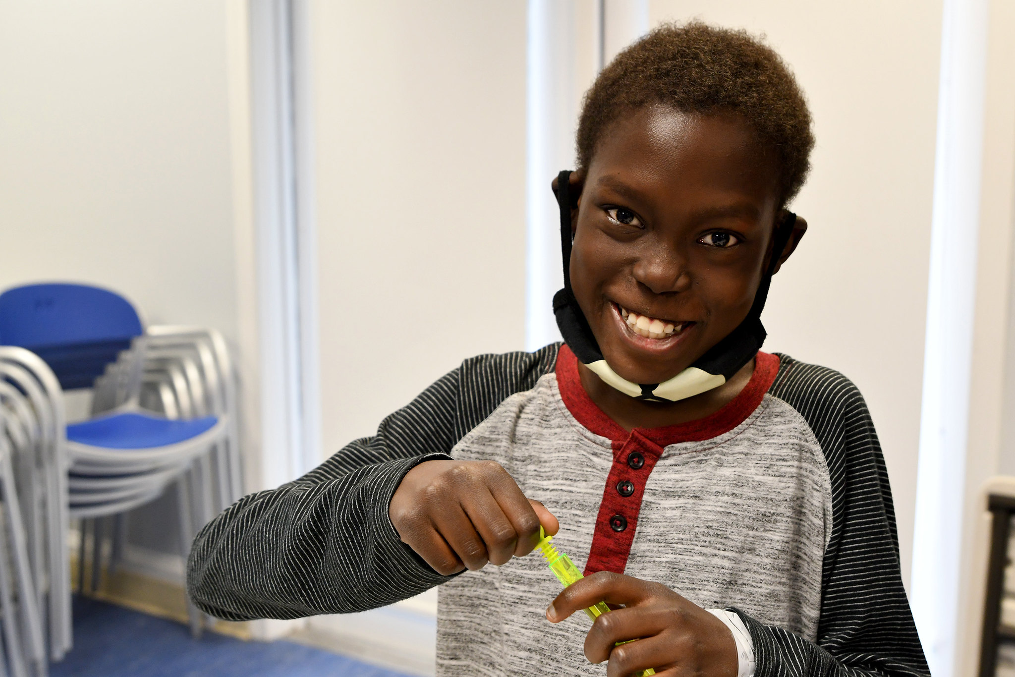 Young boy playing with bubbles