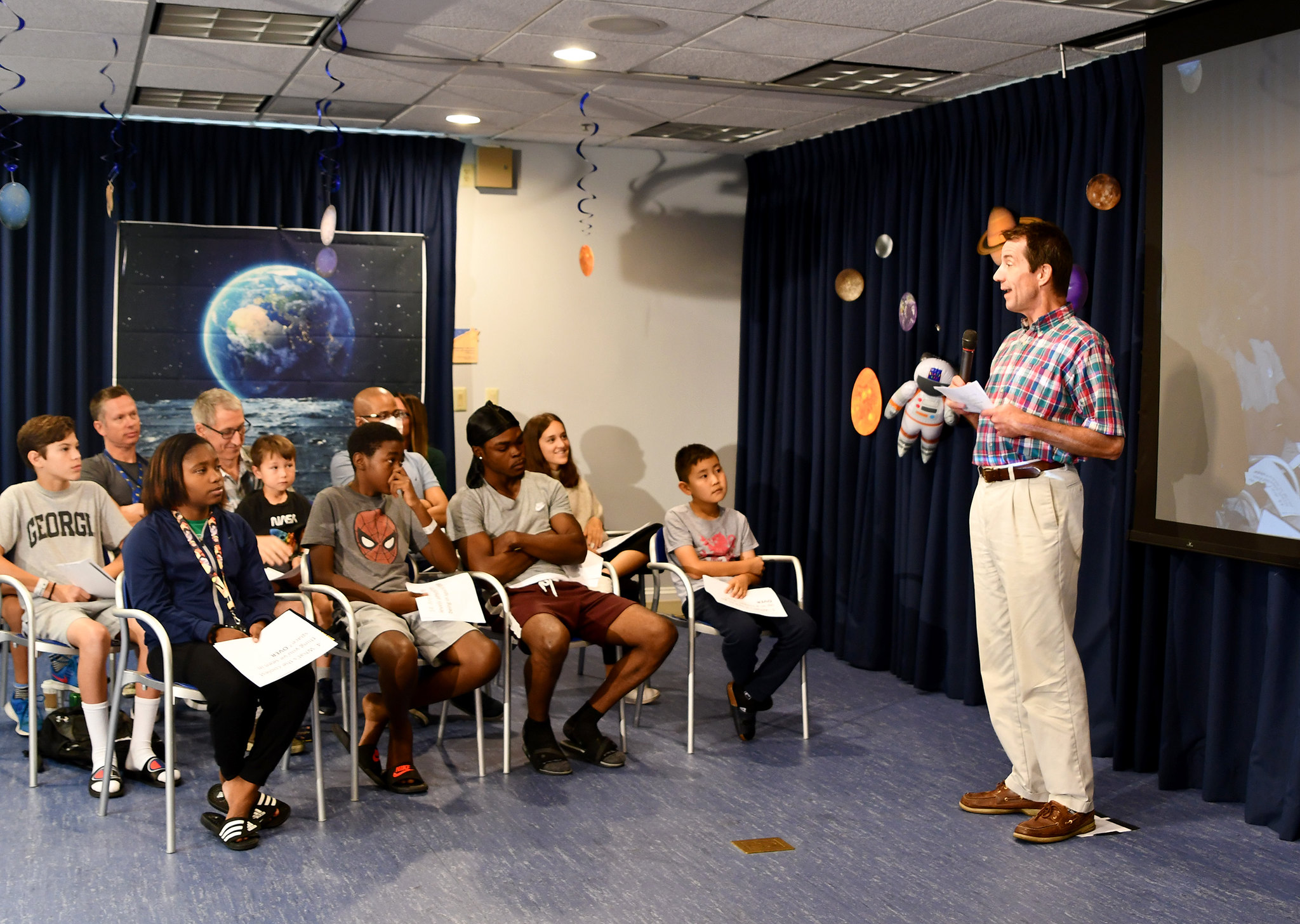 NCATS Director Dr. Chris Austin addresses Inn residents