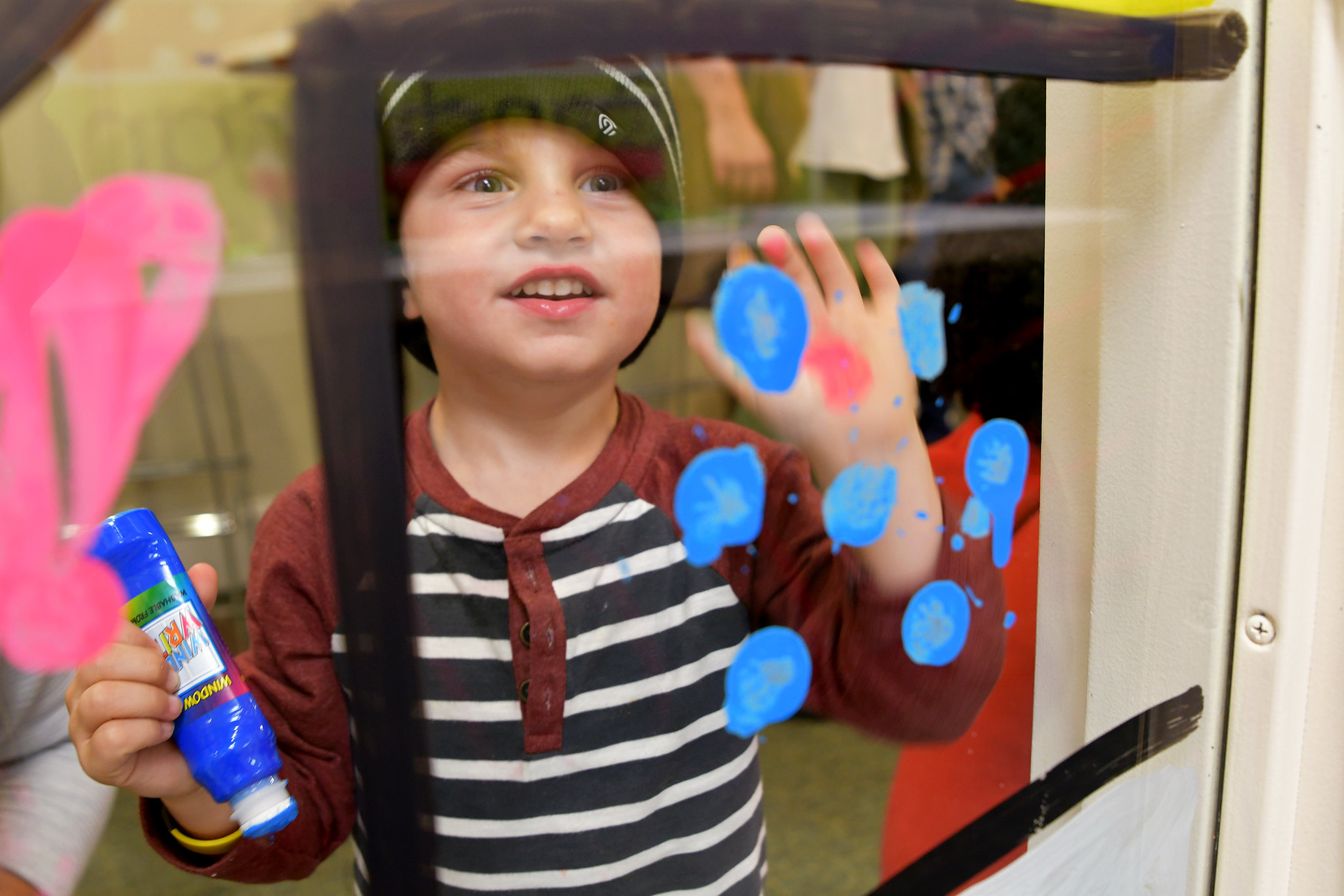 boy window painting