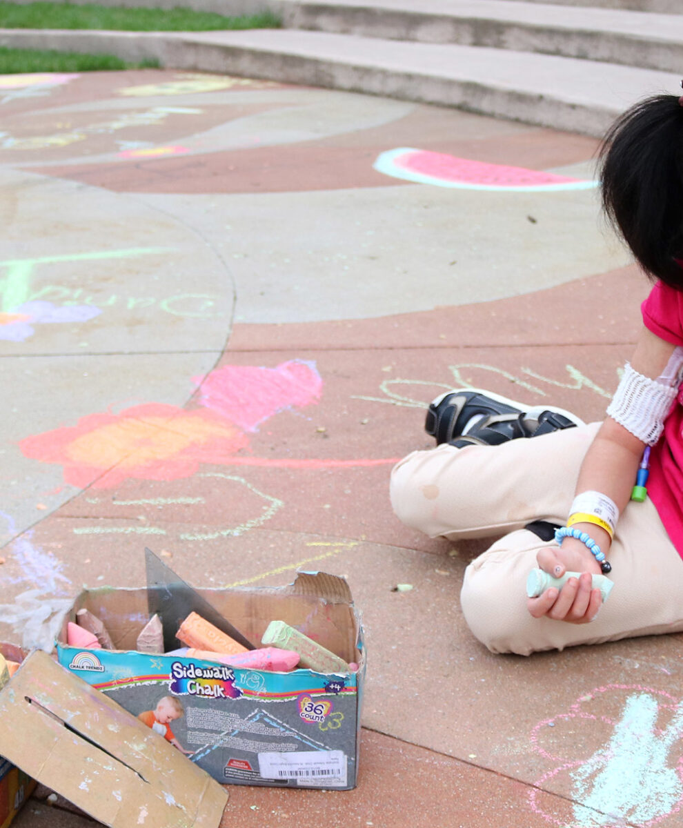 Muna on the playground with chalk
