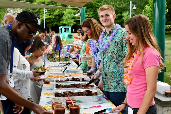 Children's Inn volunteers serve dinner