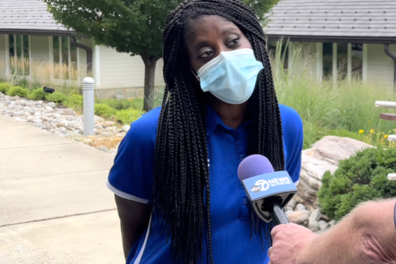 Aisha with news crew