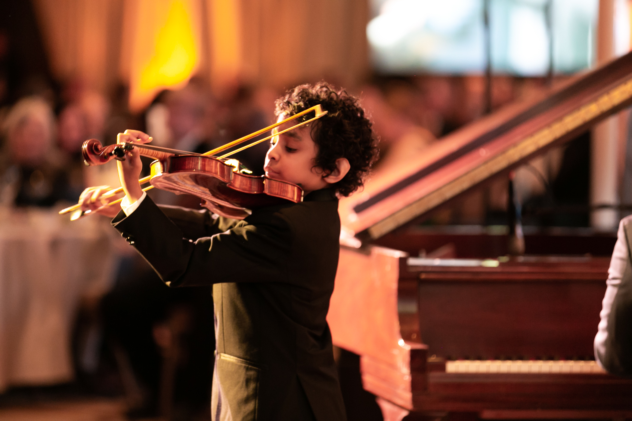 photo of child paying violin