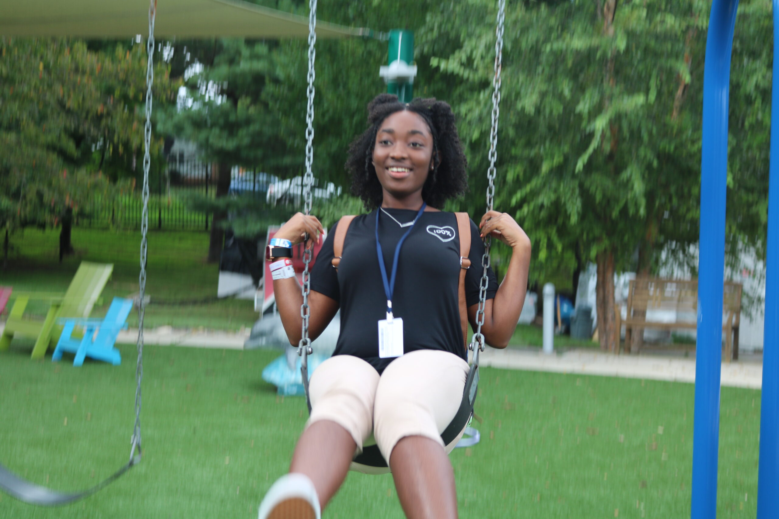 Faithanne swinging in a park