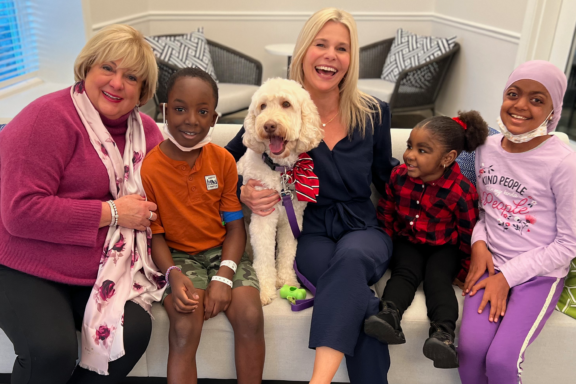 Susan Penfield and Jennie Lucca photo with children and therapy dog Zilly