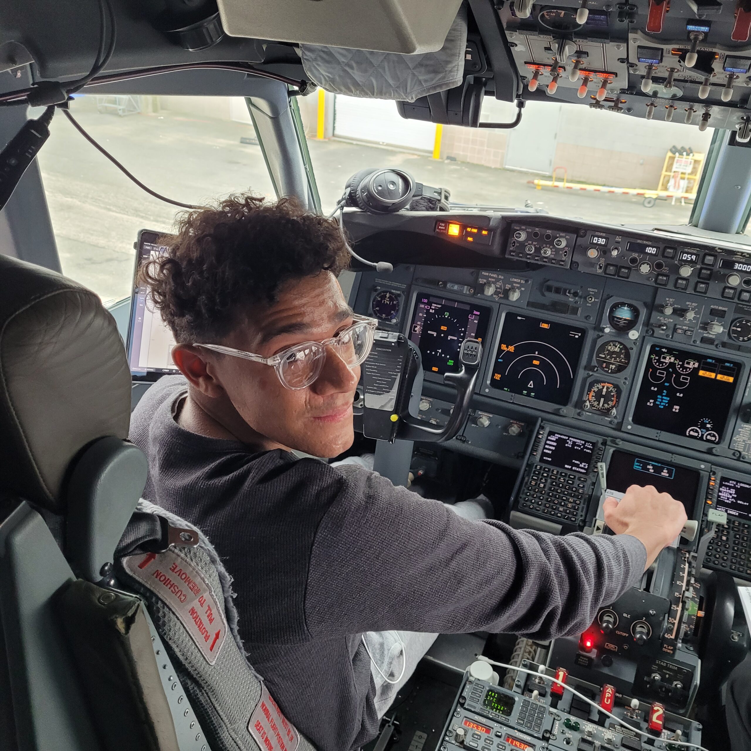 photo of Tyler in plane cockpit